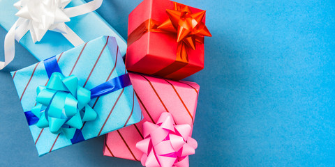 Wrapped gifts with on blue background with copy space for text