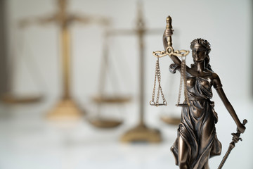 Law symbol composition. Themis statue and scale of justice on off-white background.