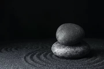 Fotobehang Spa stones on black sand with beautiful pattern, space for text. Zen and harmony © New Africa