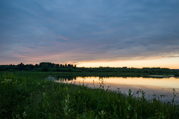 Summer colorful landscape - sunset and river