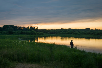 Obraz na płótnie Canvas Summer colorful landscape - sunset and river