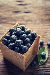 Fresh blueberries on wood