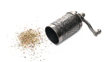 Retro silver pepper mill with minced, crushed pepper flakes mix, isolated on white background