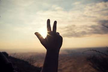 3 finger - Three finger sign sunrise view