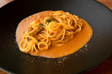 Spaghetti Seafood Sauce on a Black Plate