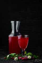 Fresh Morse of Cranberry Berries In a glass. Top view. On a black background.