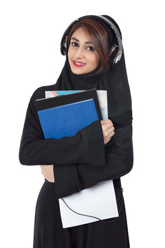 Arab student wearing abaya, holding documents and notes