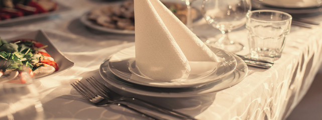 banquet hall of the restaurant, beautifully decorated tables with food
