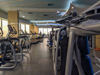 Modern gym equipment interior for weight loss and more healthy and active life for increasing strength and endurance