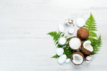 Fototapeta na wymiar Cosmetics from coconut and coconut oil. The concept of cosmetics and spa. Top view. Free copy space.