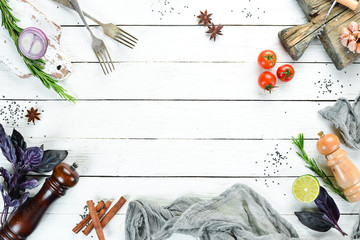 The background of cooking. On a white wooden background. Top view. Free space for your text.