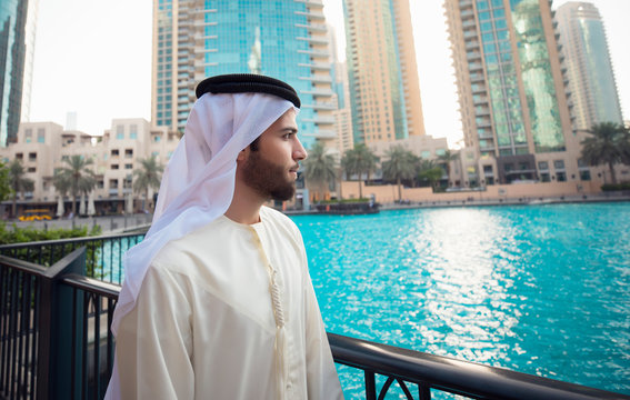 Arab young man looking to Dubai skyline