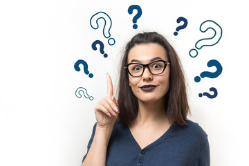 Image of excited young lady with glasses. Looking camera have an idea. Stands on a white background.