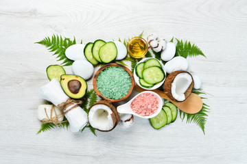 Fototapeta na wymiar Natural Cosmetics: Avocado, coconut, sea salt and face cream. The concept of cosmetics and spa. Top view. Free copy space.