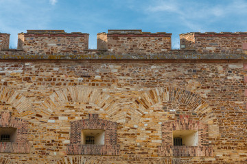 Close-up view of the massive fortification wall in the Ehrenbreitstein Fortress in Koblenz, Germany on a beautiful sunny day with a blue sky. The fortress is part of the UNESCO World Heritage Site.