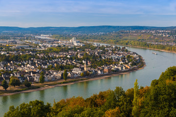 Great panoramic view of the city Koblenz and the Rhine river from the wooden viewing platform on the peak of the hill at the Ehrenbreitstein Fortress on a nice autumn day with a blue sky.