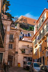 Fototapeta premium Charming narrow streets in Alfama district, Lisbon, Portugal
