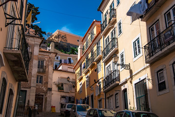 Fototapeta na wymiar Charming narrow streets in Alfama district, Lisbon, Portugal
