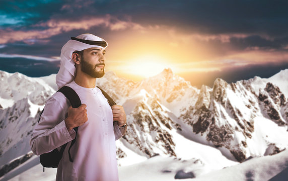 Arab Man Climbing Mountain For New Challenge - Ambition And Hopefulness Concept