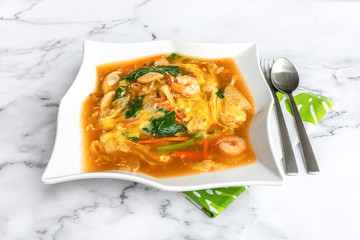 Rice noodles in egg gravy, also know as Wat Tan Hor, is a Cantonese noodle dish and literally means smooth egg gravy over hor fun (flat rice noodles).