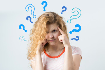 Image of excited young lady with glasses. Looking camera have an idea. Stands on a white background.	