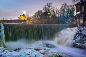 Power plant and waterfall in winter light