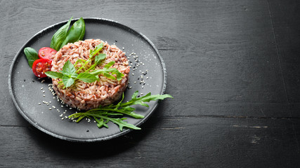 Boiled wild rice with arugula. Dishes menu. Free copy space. Top view.