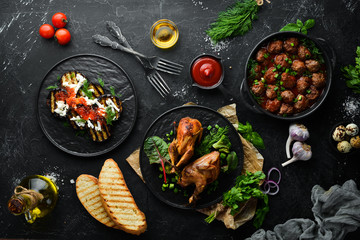 Set of dishes and food. Caviar, quail, meat balls. Flat lay. Top view. Free copy space.