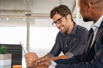 Businessmen working together at desk