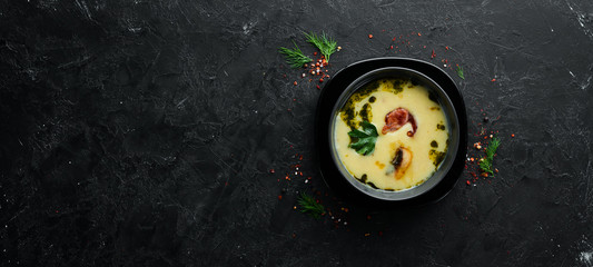 Mashed potato soup with mushrooms and bacon. Top view. Free copy space.