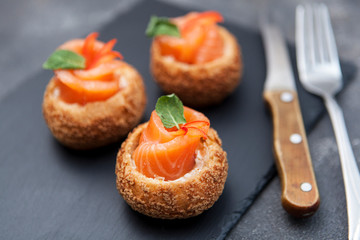 Gourmet salmon appetizer. Sandwich with salmon.
