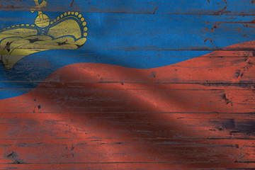Liechtenstein flag on an old wooden plank forming a background