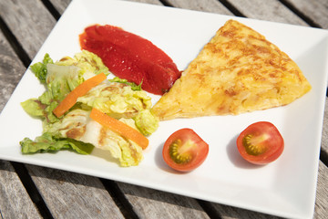 Spanish omelette tortilla with salad tomato tomatoes paprika vegetarian healthy eating food