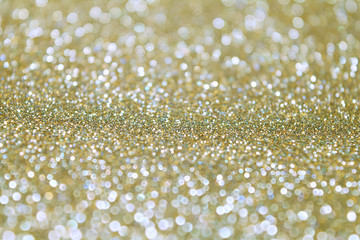 Sparkle Glitter Lights Background. Vintage Gold Champagne Color. Shine Bokeh Effect. For party, holidays, celebration.