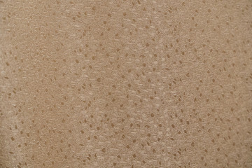 Fabric background light shade. Curtains in the room. Folds on the fabric.