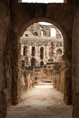 Fototapeta na wymiar Old antique amazing well conserved huge Amphitheatre of El Jem in Tunisia. Vertical color photography.
