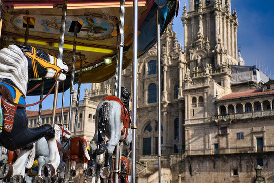 merry-go-round with horses and visit the cathedral of Santigo de Compostela. Palza del Obradoiro on a sunny Christmas day