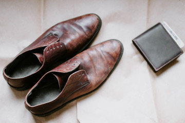 brown retro leather shoes and wallet.