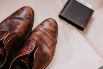 brown retro leather shoes and wallet.
