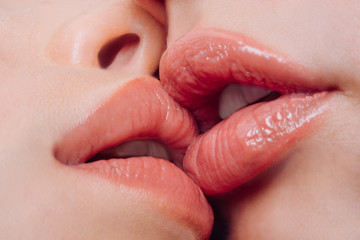 Big lips. Closeup mouth. Beauty and fashion. Closeup of women mouths kissing. Young woman close up. Advertising and commercial design. Sexy lips. Lesbian couple kiss lips. Professional makeup.