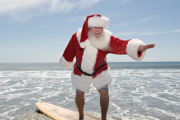 Santa Claus Surfing On Beach