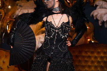 Shiny show girls with crazy black leather and feather outfits with crystals in Eastern Europe...