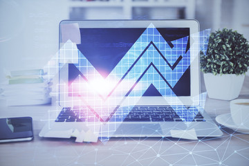 Computer on desktop with point up arrows hologram. Double exposure. Concept of success.