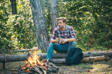 Man camping in forest. Tourists relaxing. Tourism concept. Picnic time.