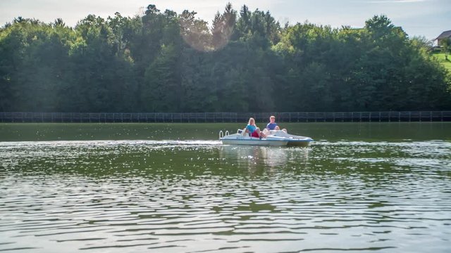 Couple on a pedal boat on a lake