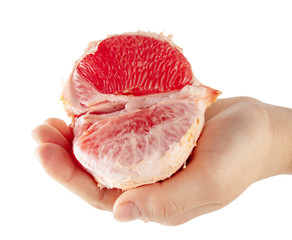 Peeled pomelo in hand isolated on a white background