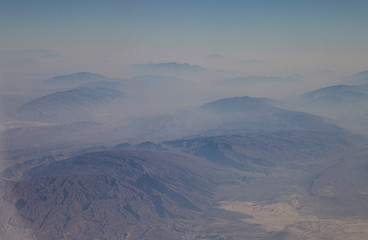 Aerophotography of the rocky mountains from the airplane