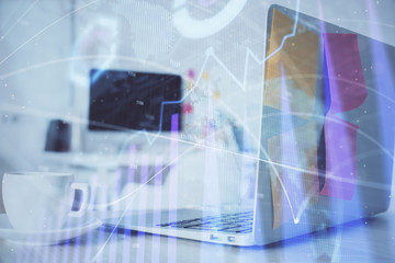 Forex Chart hologram on table with computer background. Multi exposure. Concept of financial markets.