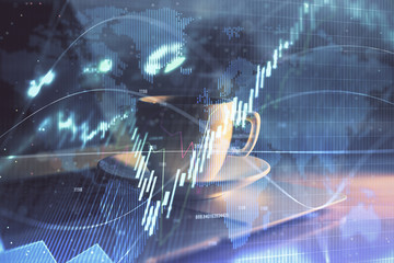 Stock market graph on background with desk and personal computer. Multi exposure. Concept of financial analysis.