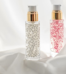 Skincare serum and make-up primer gel bottle, moisturizing lotion and lifting cream emulsion,...